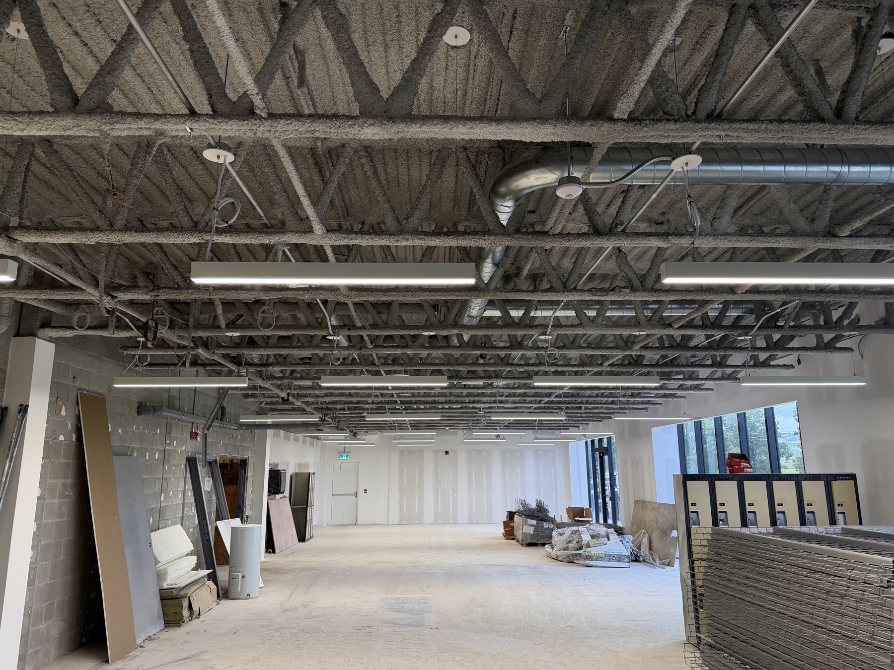 Overhead sprinkler drops through open ceiling, APT Auto Parts