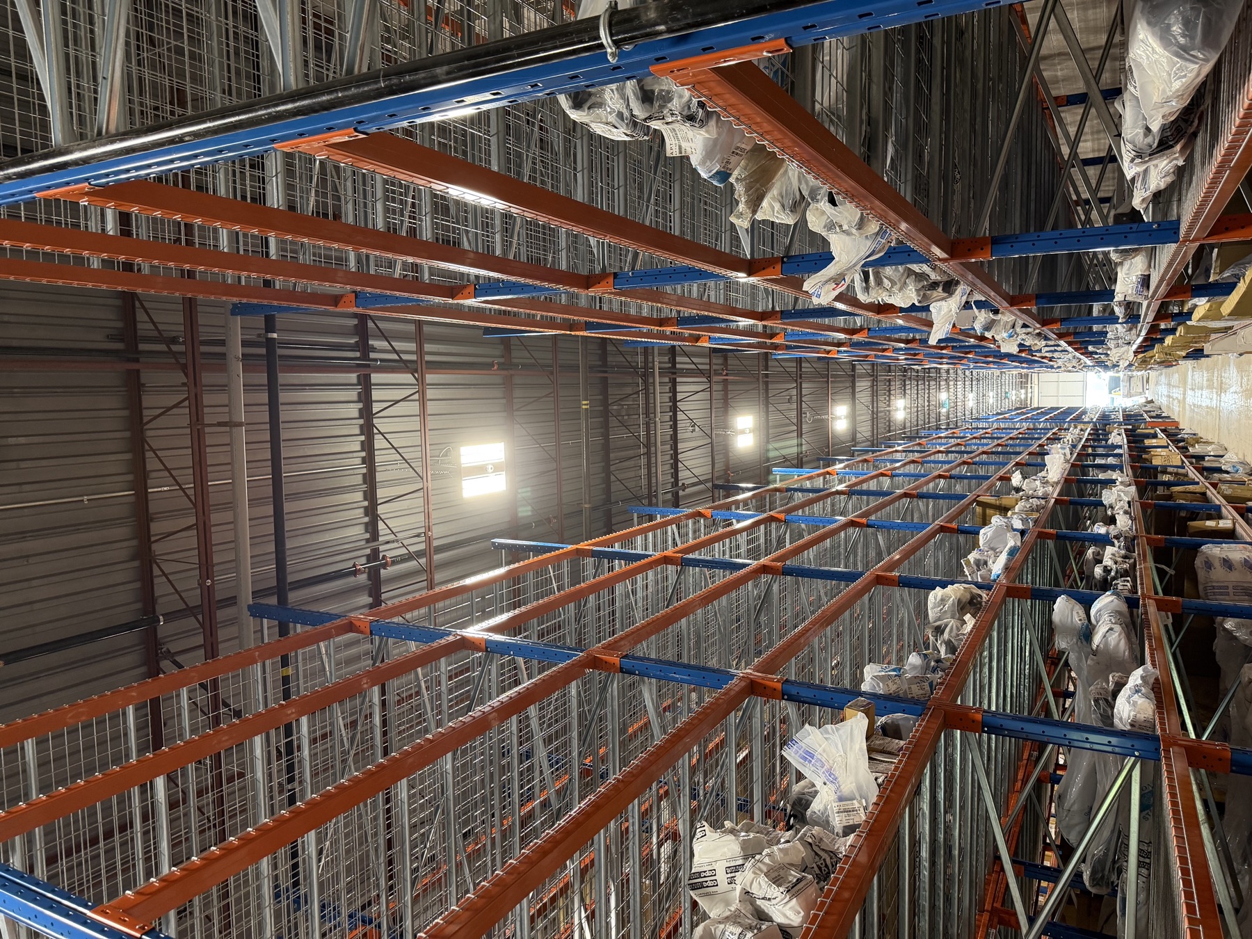 In-rack sprinkler branch lines through high-bay storage, APT Auto Parts